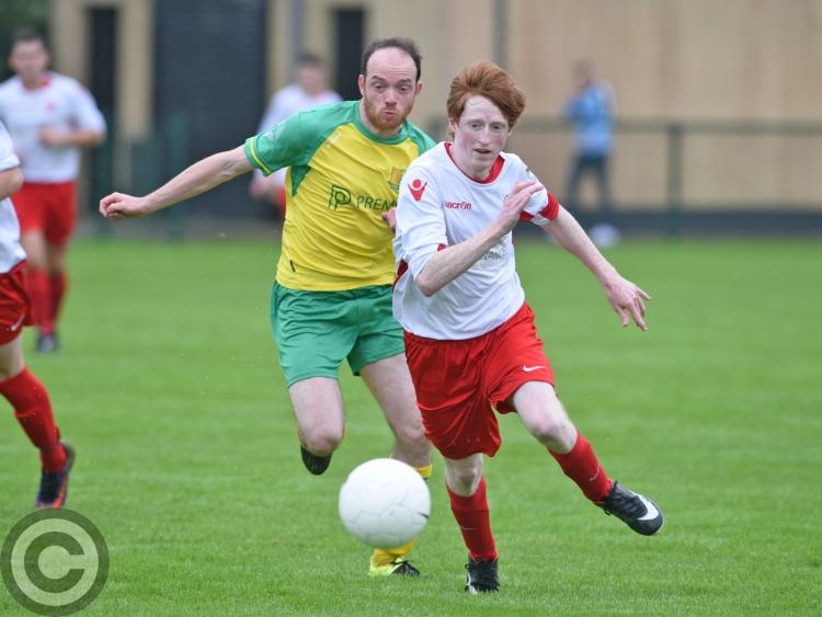 11-goal Rock advance in Tully Cup