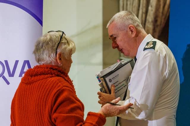Moira Todd, sister of Eugene Simons, speaks with PSNI Chief Constable Jon Boutcher following the publication of the final Kenova report. Pic: Liam McBurney/PA Wire