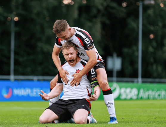 Dundalk captain Daryl Horgan celebrates with teammate John Ross Wilson after scoring against UCD.. Photo by Thomas Flinkow/Sportsfile