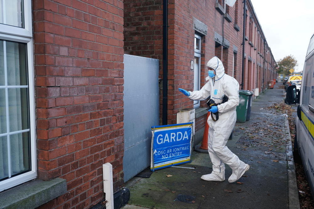 A Gardai forensic officer in Dundalk, Co Louth as they search a house in the investigation into the suspected murder of eight-year-old Kyran Durnin. Pic: Niall Carson/PA Wire