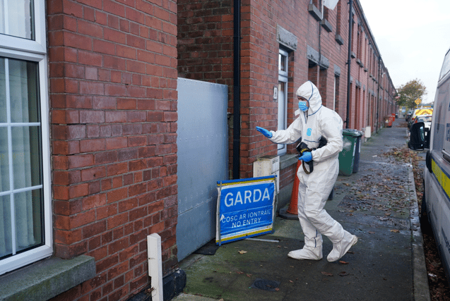 A Gardai forensic officer in Dundalk, Co Louth as they search a house in the investigation into the suspected murder of eight-year-old Kyran Durnin. Pic: Niall Carson/PA Wire