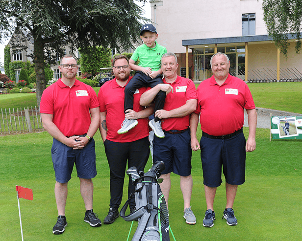 George (centre) with his fundraising team at Ballymascanlon Golf Course. Picture by Arthur Kinahan.