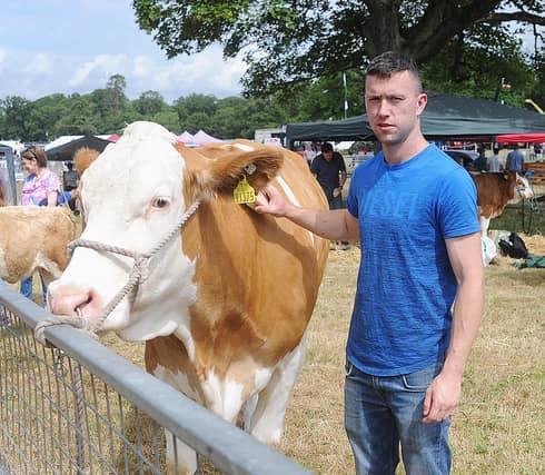 Conor Kirwan with his Simmental bull at last year's show (Photo: Arthur Kinahan)