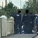 A screenshot of a video which is being shared on social media showing a garda operation on the Hyde Road