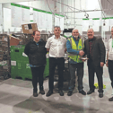 Postal operative Pat McNamara accepts the congratulations of Thomas Hehir, operations manager