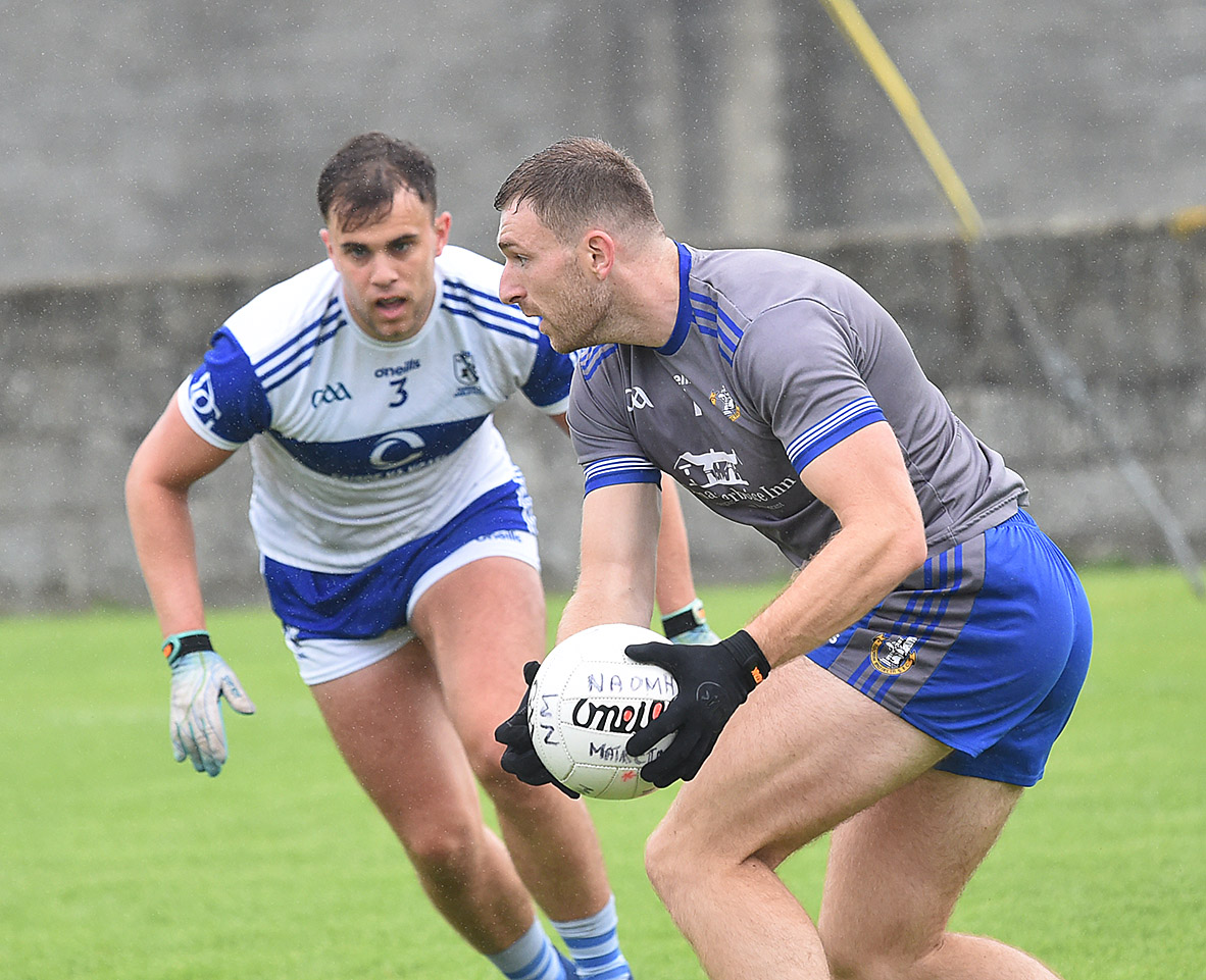 Sam Mulroy is confronted by Gaels defender Oisin Murray. (Picture: Arthur Kinahan)