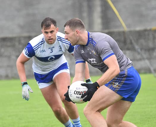 Sam Mulroy is confronted by Gaels defender Oisin Murray. (Picture: Arthur Kinahan)