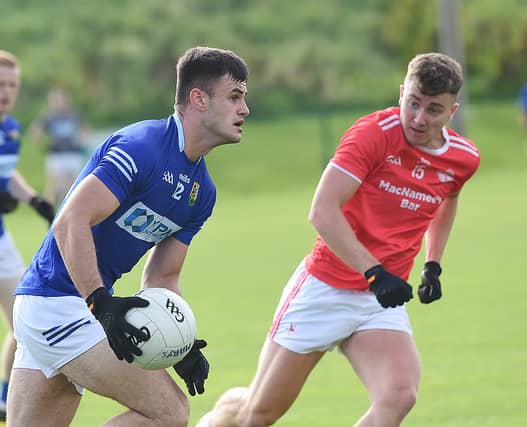 Jonathan Commins, St Mary's, taking on St Brides' Sean Marry. (Picture: Arthur Kinahan)