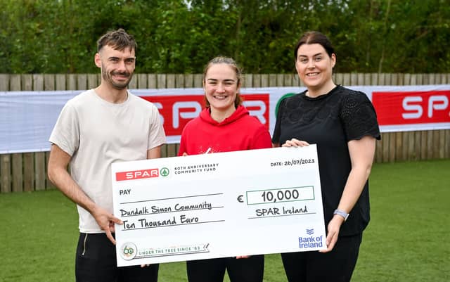 Olympic Gold Medallist and SPAR brand ambassador Kellie Harrington with Chris Duffy and Katie Carrigan of Dundalk Simon Community. Photo by Seb Daly/Sportsfile