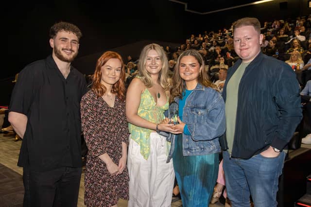 The crew of Reflection with the 2022 John Moore Film Award trophy - from L_R: Stephen Finlay, Wiktoria Rabiega, Jessica Doherty, Megan Hughes and Conor Leddy