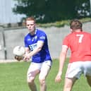 Ardee's Paraic McKenny is confronted by St Bride's Evan Wynne during their recent Div 1 game in Pairc an Chuinnigh. (Picture: Arthur Kinahan)