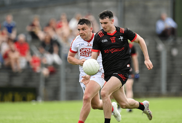 Craig Lennon of Louth in action against Sean Powter of Cork. (Photo: Sportsfile)