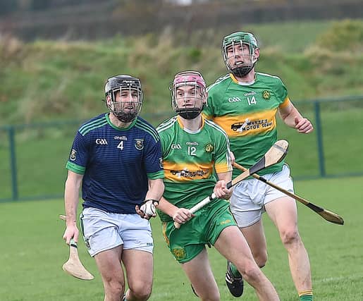 Cormac McAuley, St Fechins, has the beating of Kilcoole's Vinny Quigley and Ronan Keddy in Saturday's AIB Club Championship Quarter Final in Darver. (Picture: Arthur Kinahan)
