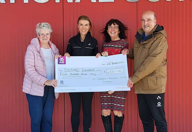 Sr Joan Watters Chairperson BOM, Karol Caulfield, Dr Roz Morris Principal St Josephs NS presenting a cheque for €400 to to Mr Peter Nolan of SOSAD proceeds of the Silly Scarf day at the school