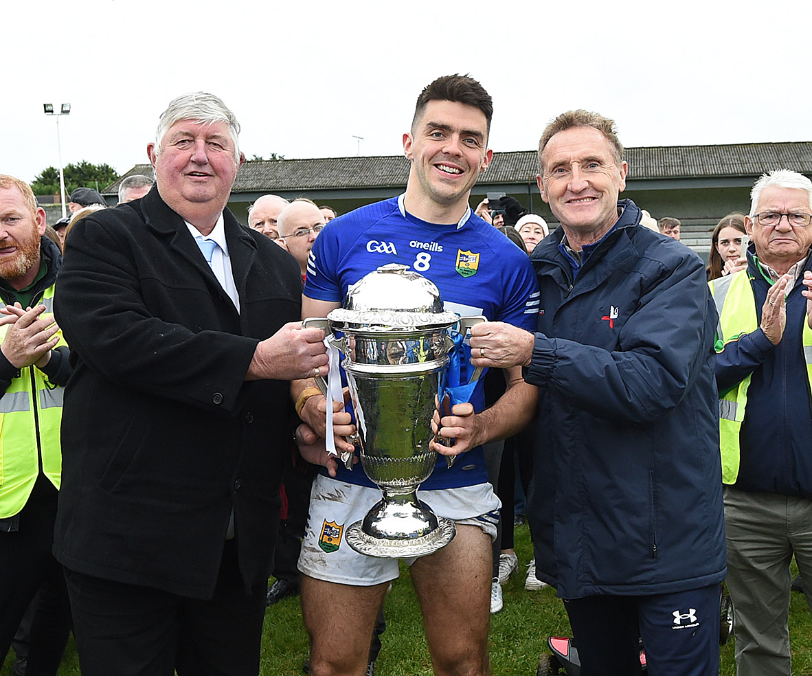 Seamus Keenan, Sponsor of Anchor Tours, and Peter Fitzpatrick, LCB Chairman, presenting the Joe Ward Cup to ST Marys Captain R J Callaghan. (Picture: Arthur Kinahan)