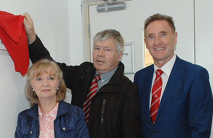Danny Nugent of the Newtown Blues unveils a plague in memory of Charlie McAlester. (Picture: Arthur Kinahan)