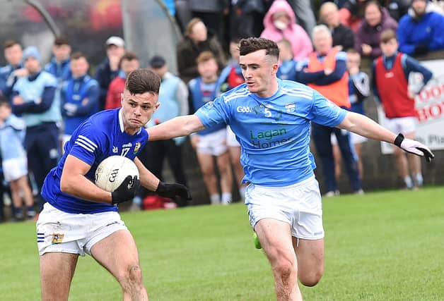 Jonathan Commins has the beating of Daire Nally during last Sunday's Senior Final at Clan na Gael Park. (Pic: Arthur Kinahan)