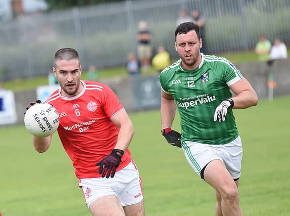 Paddy Reilly, St Brides, gets the better of Geraldines Shane O'Hanlon in Sunday's Senior championship game in Clan Na Gael Park. (Pic: Arthur Kinahan)