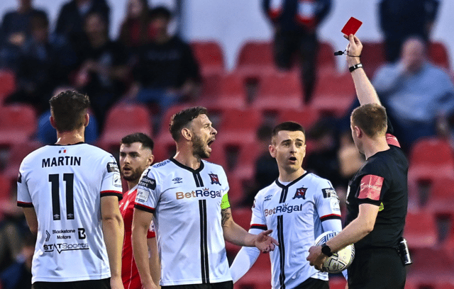 Darragh Leahy of Dundalk, second from right, is shown a red card by referee John McLoughlin during the SSE Airtricity League Premier Division match between Sligo Rovers and Dundalk at The Showgrounds