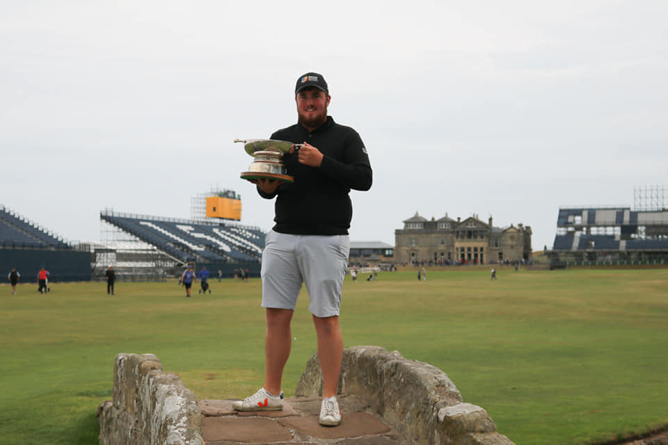 Eoin Murphy poses with his trophy on the famous bridge at St Andrews, where he secured the Boyd Quaich Memorial Trophy
