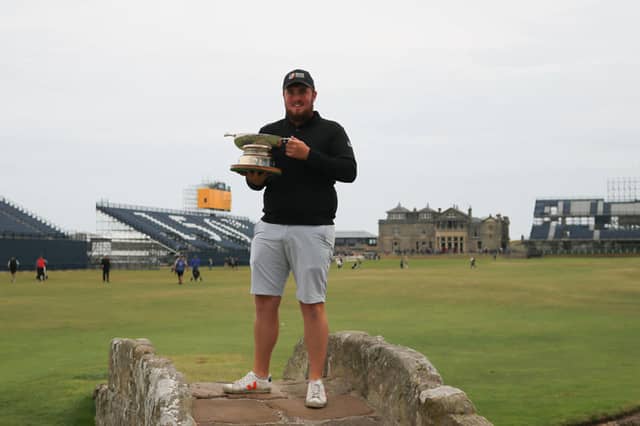 Eoin Murphy poses with his trophy on the famous bridge at St Andrews, where he secured the Boyd Quaich Memorial Trophy