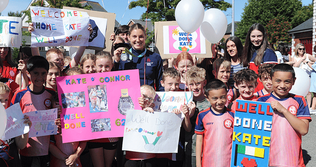 Kate with her medal and members of St Gerard's AC. Photo: Arthur Kinahan