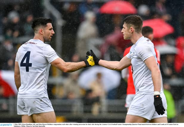 Ryan Houlihan, left, and Shea Ryan, both of Kildare, congratulate each other. (Pic: Seb Daly/Sportsfile)