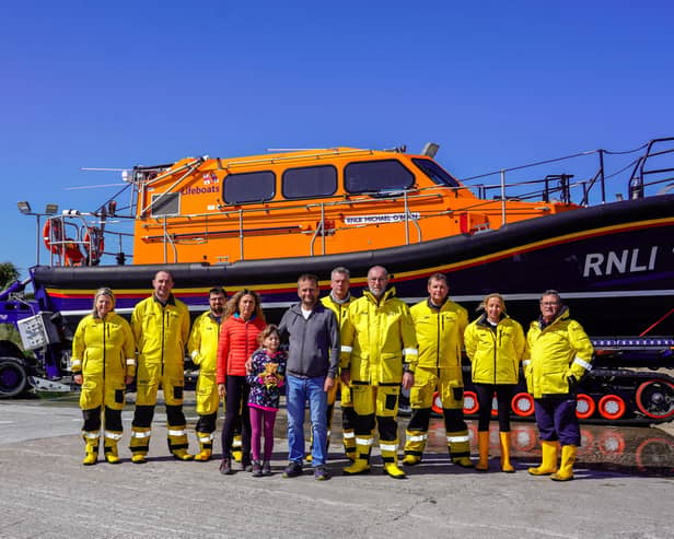 Clogherhead RNLI with rescued kayaker and his family launching Mayday Mile for the RNLI