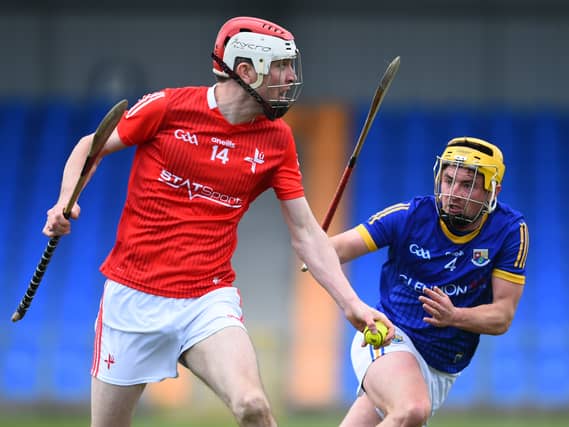 Andrew Mackin gets away from the clanngle of Longford's Enda Naughton