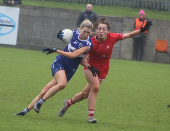 Laois midfielder Aisling Quigley and Eimear Byrne of Louth. (Photo: Leinster LGFA)