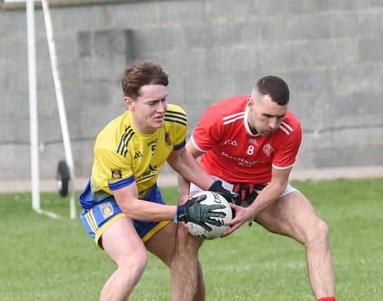 Conor Garland, ST Mochtas, and Bernard Lavery, St Brides, contest this ball during a Div 1 league game in Knockbridge. (Pic: Arthur Kinahan)