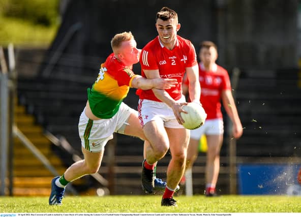 Dan Corcoran of Louth is tackled by Conor Doyle of Carlow . (Pic: Sportsfile)