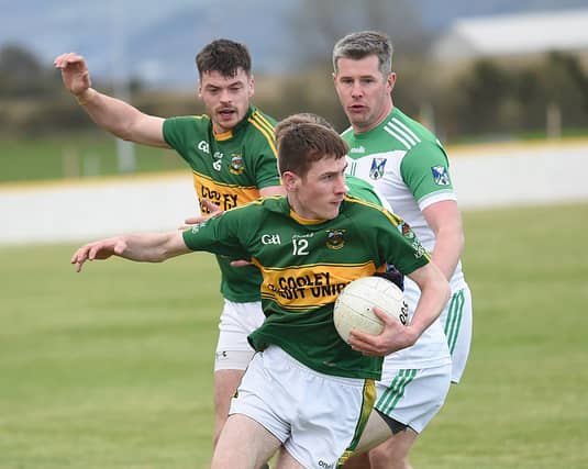 Cooley's Enda O Neill gets the better of the Geraldines Conor Rafferty in their Div 1 league game in Fr McEvoy Park. (Pic: Arthur Kinahan)
