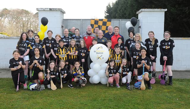 Peter Fitzpatrick: Peter Begley; Seamus Cahill; and Brendan Arrowsmith, with members of Na Piarsaigh Blackrock hurling and camogie teams (PIC: Arthur Kinahan)