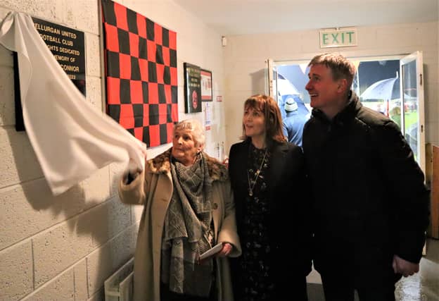 Betty O'Connor unveils a plague commemorating Bellurgan's new floodlights being named in honour of her son Michael. Also pictured is Michaels's wife Rosaleen and Ireland manager Stephen Kenny