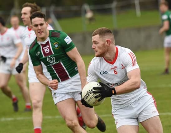 Niall Sharkey, Louth, soloing away from Westmeath's Sam Duncan. (Pic: Arthur Kinahan)