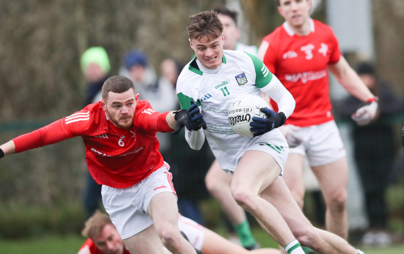 Louth's Brian Sharkey tries to get the ball from Limerick's Brian Donovan during their Division 3 Allianz Football League fixture at UL North Campus on Sunday. (Pic: Keith Wiseman)