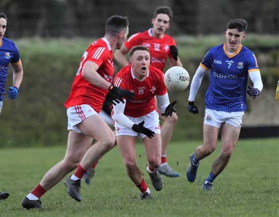 Ryan Burns tries to get the ball off to a teammate in Louth's O'Byrne Cup clash away to Longford. (Photo: Syl Healy)