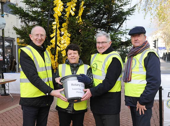 Rotary members Con Shanahan, Catherine White , Tom Clarke and Tony Nordon collecting at the Remembrance Tree in Earl Street (PIC: Arthur Kinahan)
