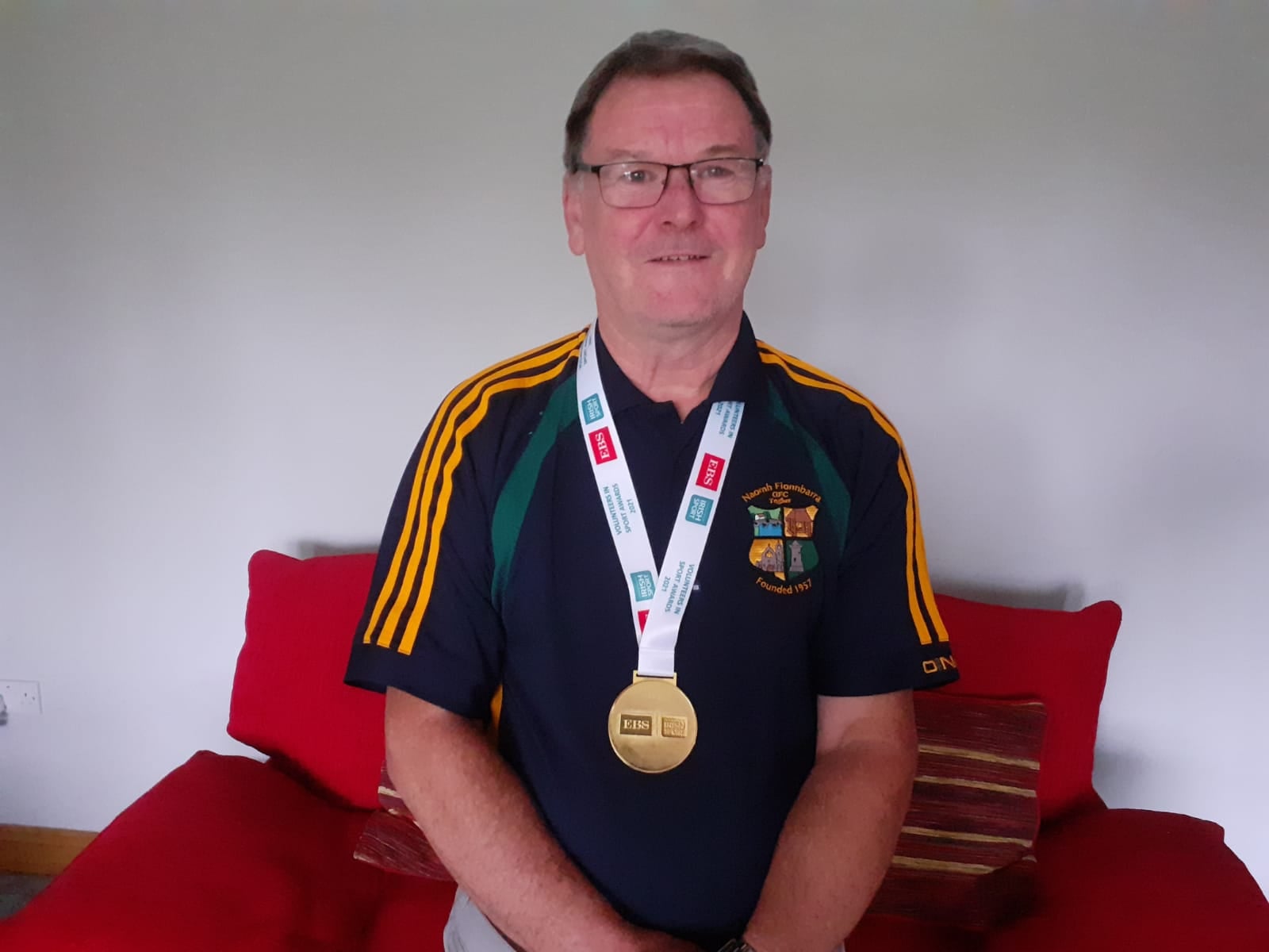 Naomh Fionbarra's Peter Callan with his Volunteers in Sport Award Medal
