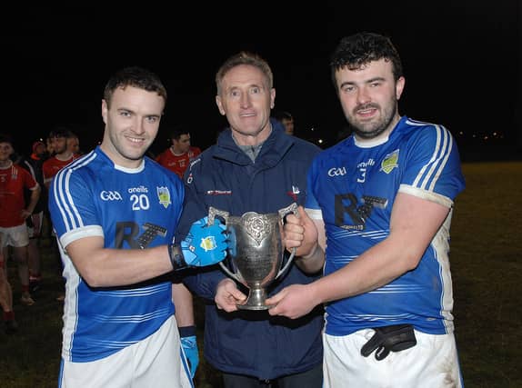 Kevin Quigley and Liam Rice, Captains of Roche, receiving the trophy from LCB Chairman Peter Fitzpatrick in Darver. (Pic: Arthur Kinahan)