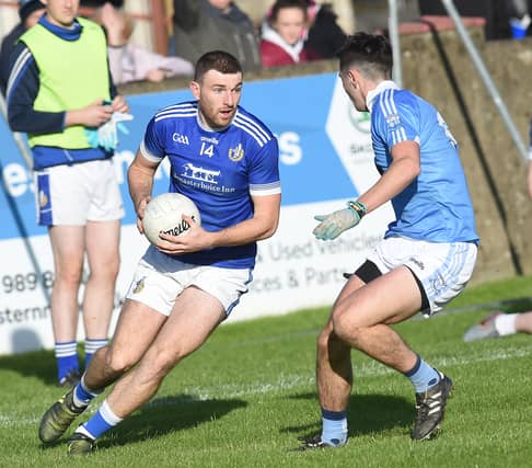 Naomh Máirtín's Sam Mulroy takes on Emmet Carolan of Newtown Blues during Sunday's senior final at The Gaelic Grounds, Drogheda. (Pic: Arthur Kinahan)