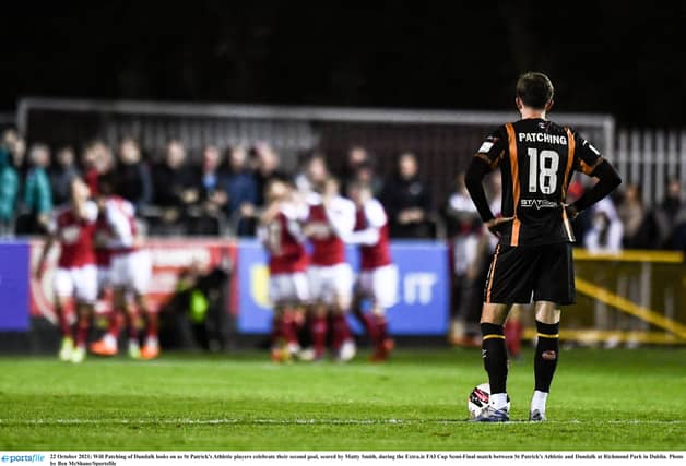 Will Patching watches on as St Pats' players celebrate regaining the lead. (Pic: Ben McShane/Sportsfile)