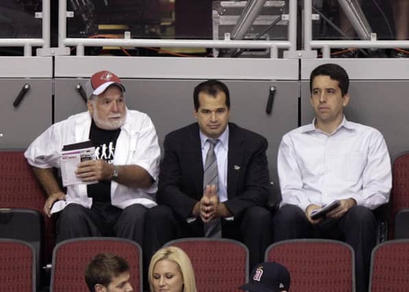Dundalk FC chairman Bill Hulsizer, left and his son Peak6 owner Matt, centre