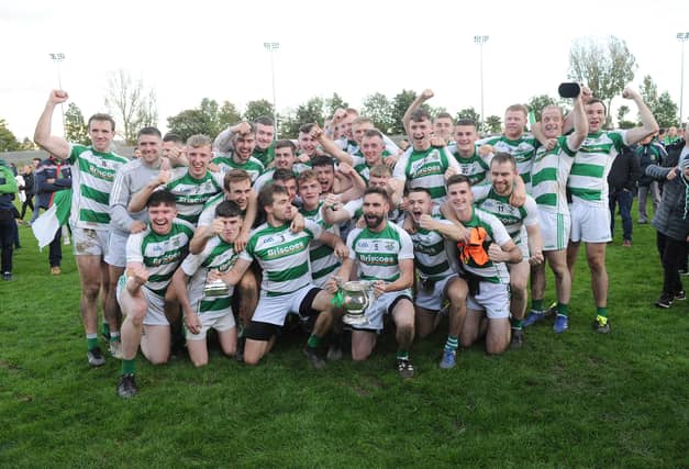The St Fechins team celebrate with the Seamus Flood Cup. (Pic: Arthur Kinahan)