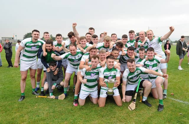 The St Fechins players celebrate with the Paddy Kelly Cup following their win over Knockbridge last week. Pic: Arthur Kinahan