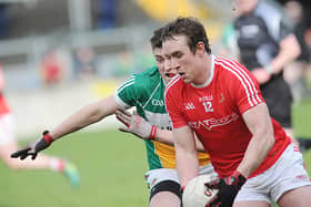Louth's Bevan Duffy taking on Offaly's James Lawlor