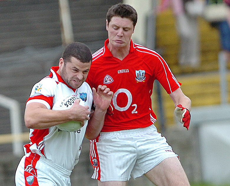 Louth's Colin Goss rattled into Cork's Michael Cussen during the 2007 All-Ireland qualifier at O'Moore Park, Portlaoise. (Pic: Arthur Kinahan)