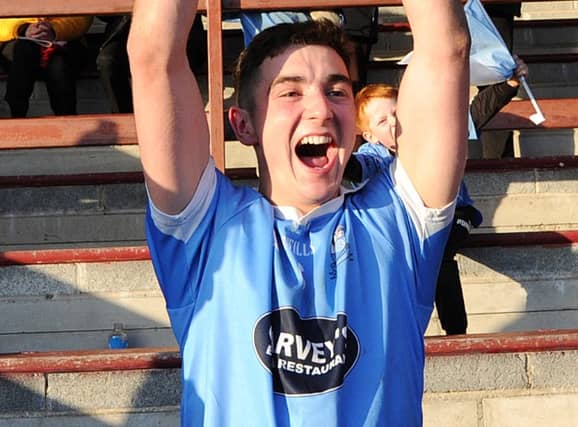 Newtown Blues captain Emmet Carolan holds aloft the Joe Ward Cup after Sunday's Anchor Tours SFC final win over Naomh Máirtín in Drogheda. (Pic: Arthur Kinahan)