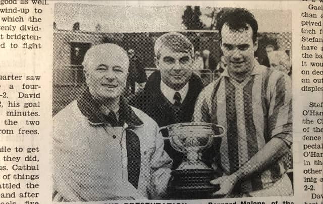 Peter Branigan (County Board chairman), Bernard Malone (sponsor) and Stefan White (Clan na Gael) with the Cardinal O’Donnell Cup after the 1994 final defeat of Dundalk Gaels.